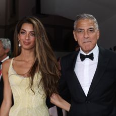 Amal Clooney, George Clooney, Brad Pitt, and Ines de Ramon attend the "Wolfs" red carpet at Venice Film Festival on September 01, 2024.