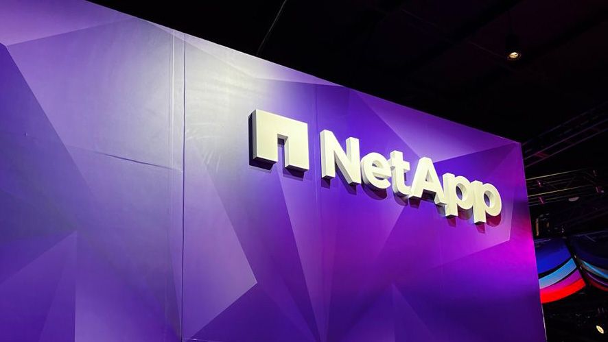 The NetApp logo displayed on a stand at the NetApp Insight 2023 conference in Las Vegas, Nevada. Decorative: the NetApp logo is white against a purple background. 