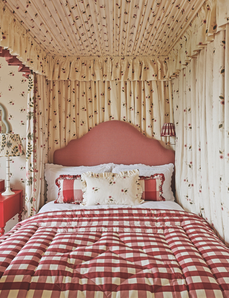 Gingham, ruffle-bordered bedscape covered by a canopy of vintage-inspired berry-print oyster linen drapes