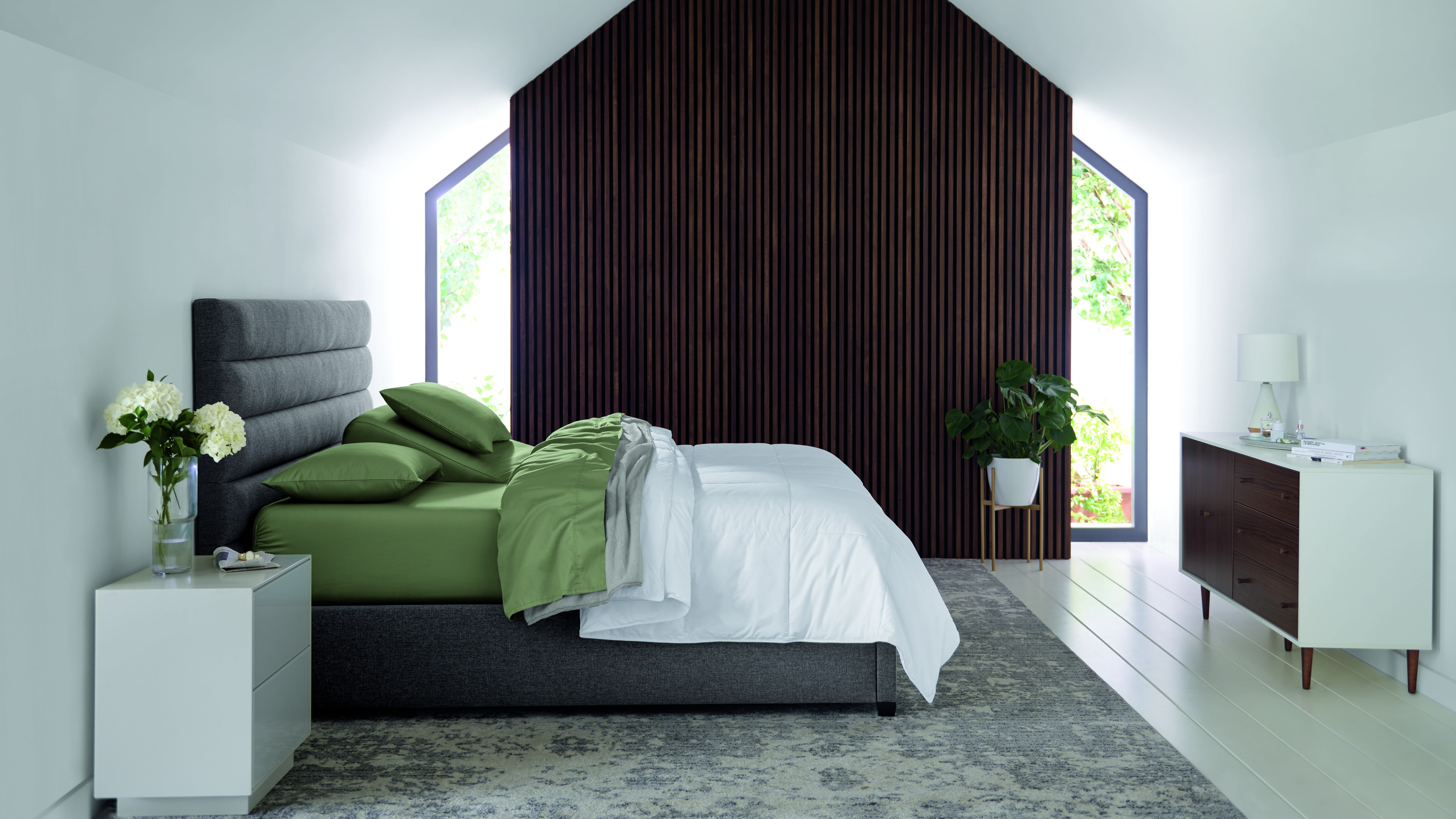 A Sleep Number smart bed in a well-appointed bedroom.