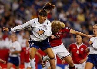 The Womens World Cup quarterfinals were played at Gillette Stadium in Foxboro, MA on 10/01/03. The second 1/4 final match has the USA playing Norway in the single elimination round. USA defeated Norway 1–0 on a goal by Abby Wambach. USA defender Joy Fawcett (lt) battles for a head ball against Norway's Lise Klaveness. (Photo by Anacleto Rapping/Los Angeles Times via Getty Images)