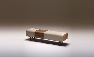Solid Canelaetto walnut wood bench upholstered in bullcalf leather.