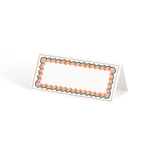 A blank paper place card with a pink, red, and green border 