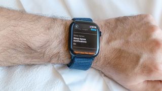 Close-up of an Apple Watch 10 on a user&#039;s wrist with the screen showing that the sleep apnea safety feature is switched on