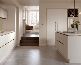 Modern white kitchen ideas with brass details in the white cabinets and island