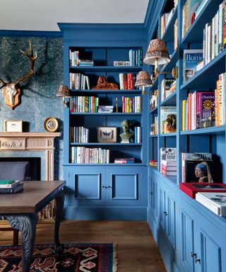 Blue library with fireplace