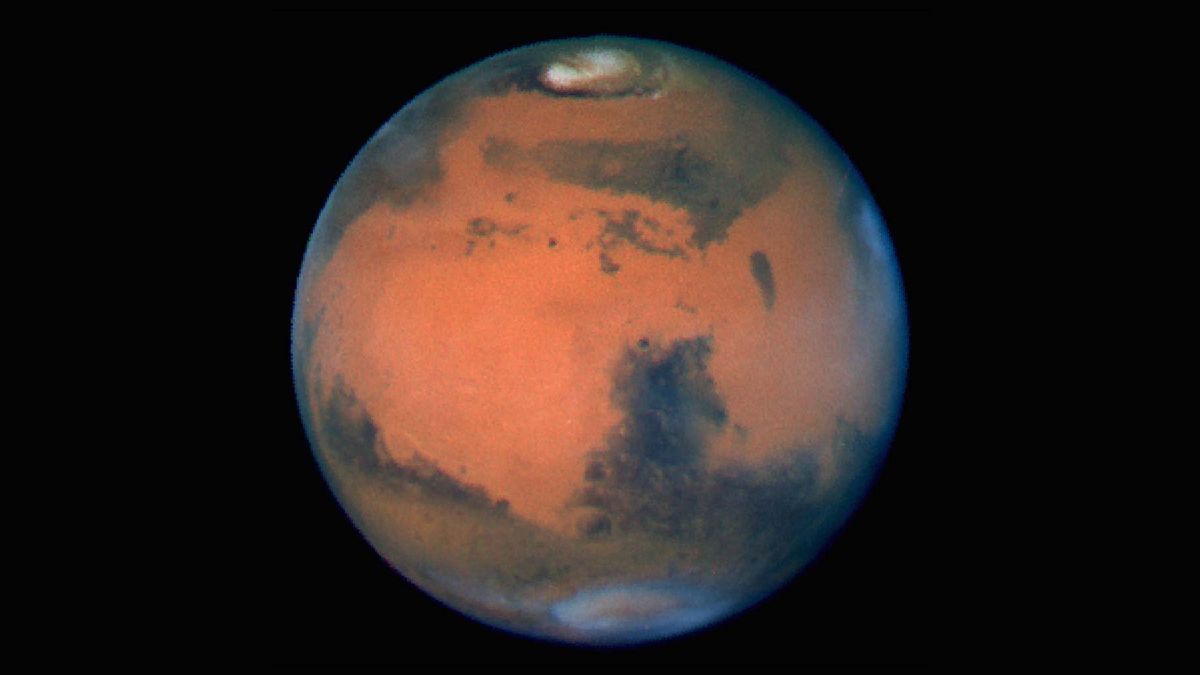 Mars in late spring. William Herschel believed the light areas were land and the dark areas were oceans.