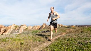 Man doing barefoot running outside