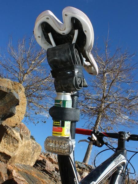 A spare tube and Genuine Innovations Big Air canister are taped to the back of the bike for quick access.