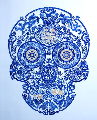 dark blue floral human skull design on a lighter blue bacground