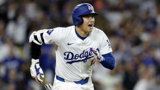 Shohei Ohtani #17 of the Los Angeles Dodgers hits a one run base hit on the way to the MLB Playoffs 2024