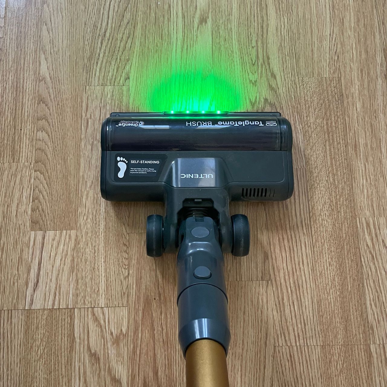 Ultenic U20 cordless vacuum with green laser on top of laminate flooring