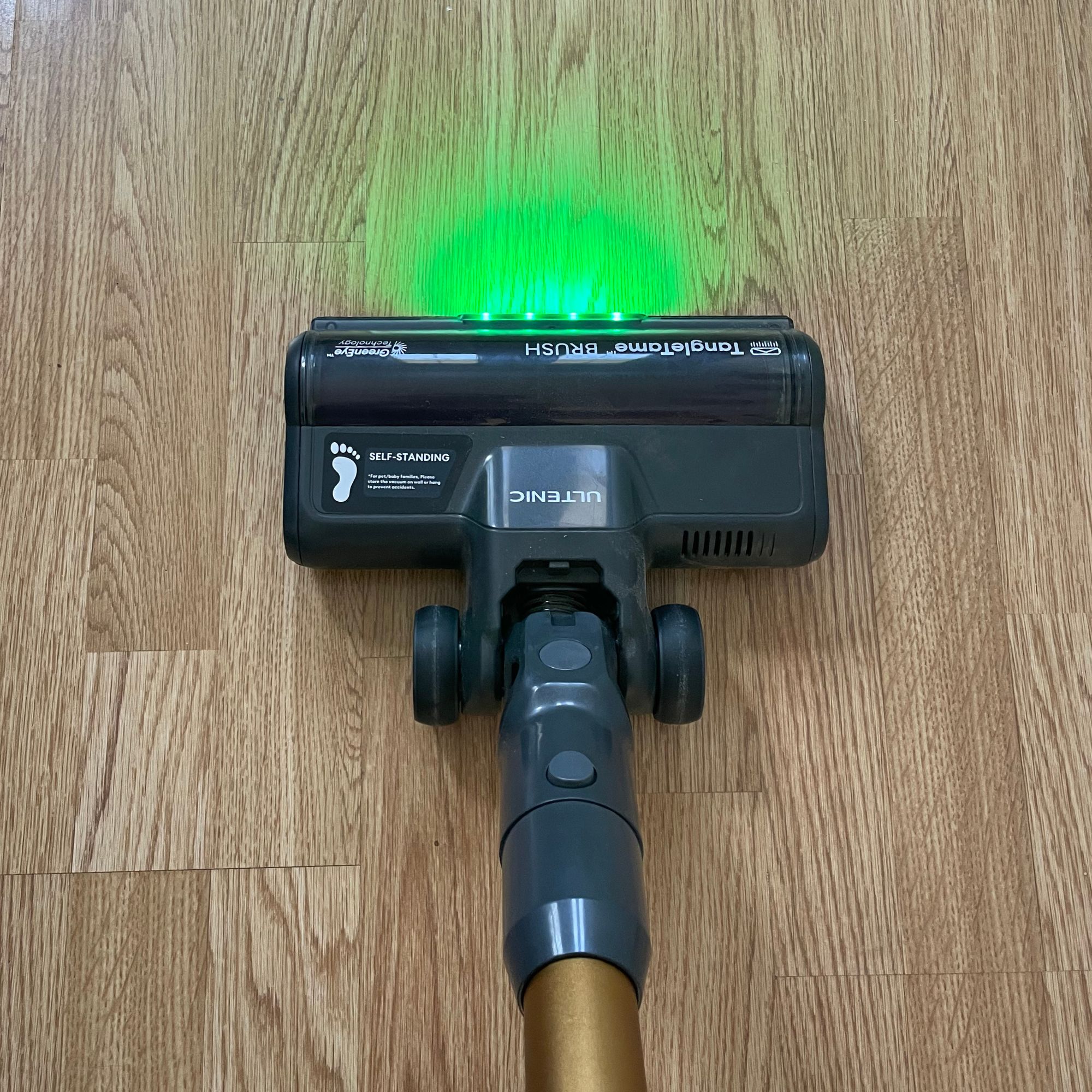 Ultenic U20 cordless vacuum with green laser on top of laminate flooring