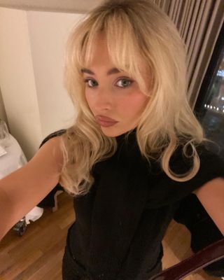 @sabrinacarpenter with curtain bangs