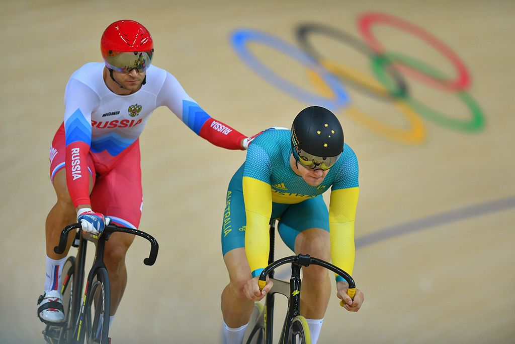 Denis Dmitriev (Russia) lays a hand on Matthew Glaetzer's (Australia) back after winning the bronze medal