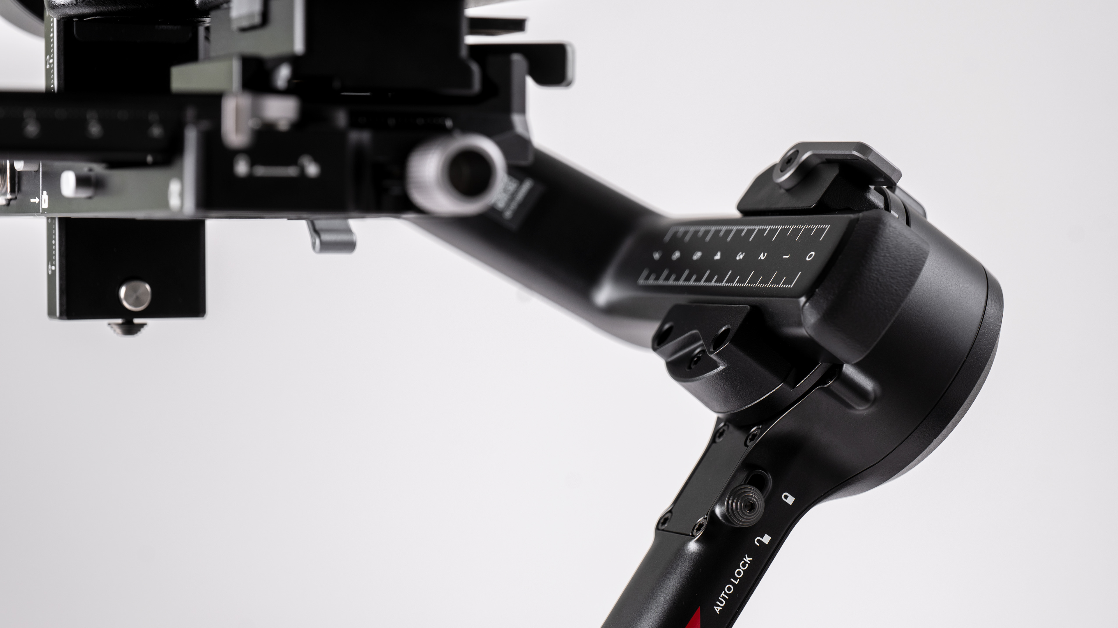 Closeup of DJI RS 4 gimbal balance system on a off-white background