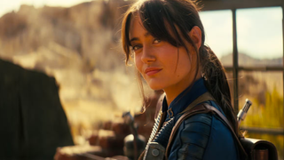 a girl in a blue jumpsuit in the wastelands