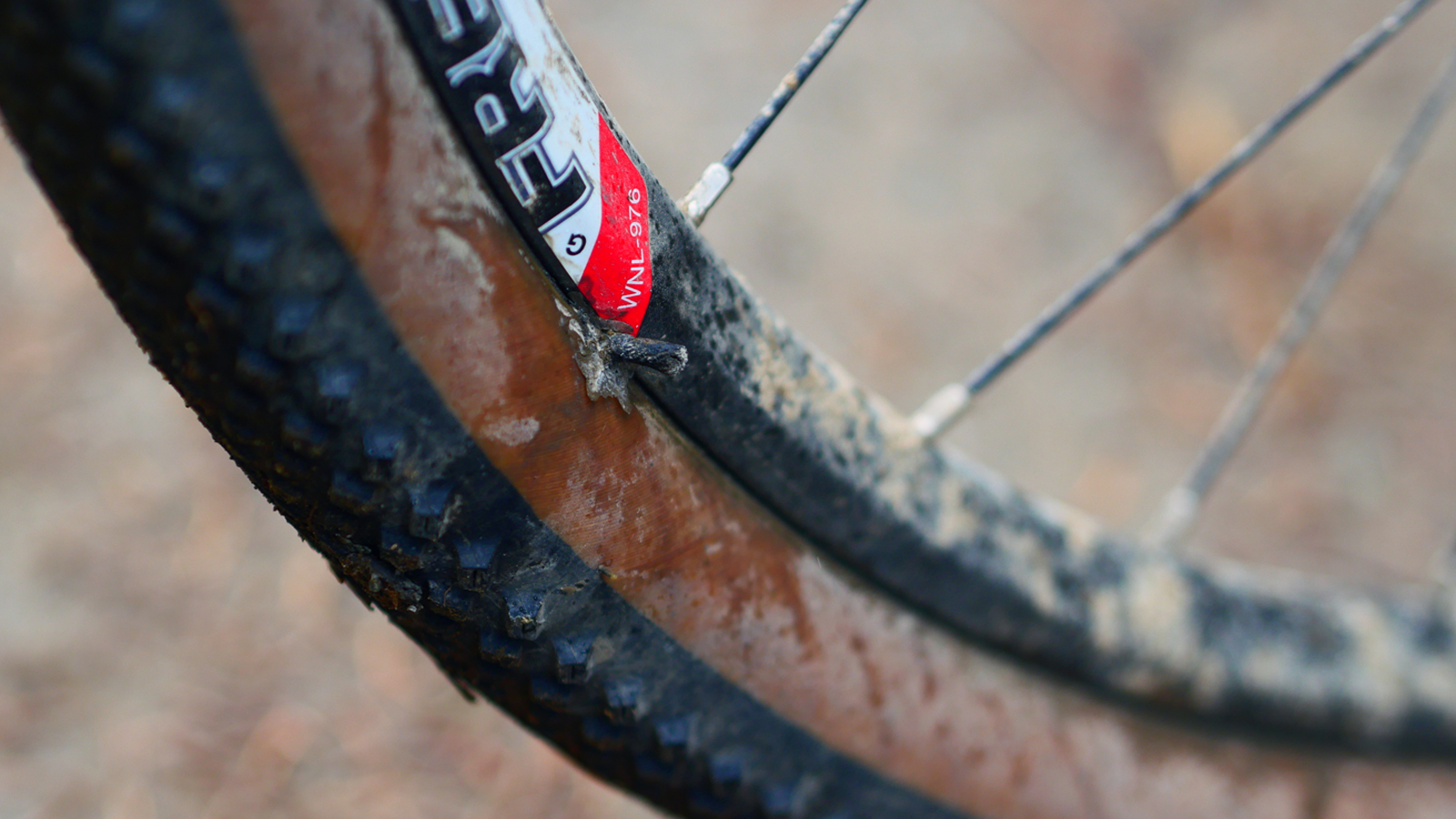 A gravel tyre with a tubless plug repair