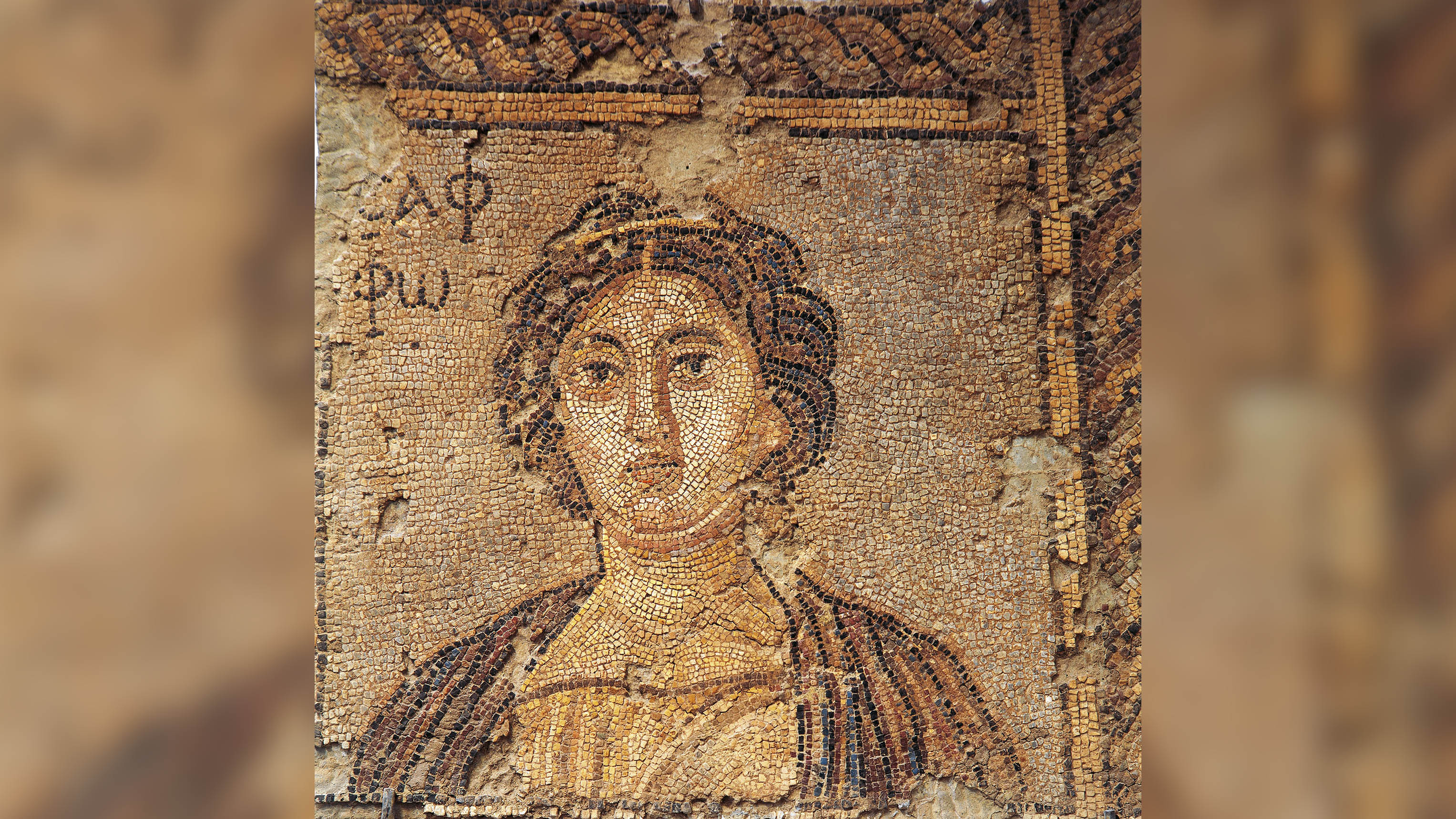 This mosaic fragment depicts the poetess Sappho.