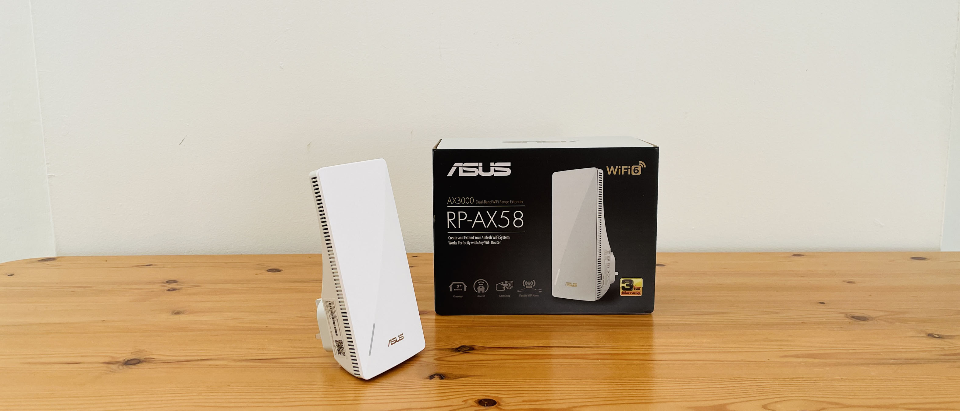 Asus RP-AX58 on a wooden table