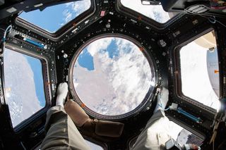 Astronaut Rick Mastracchio looks towards Earth from the Cupola in 2016.