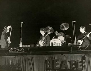 The Beatles onstage at the Gator Bowl