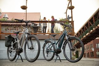 Two co-op electric bikes outside a restaurant