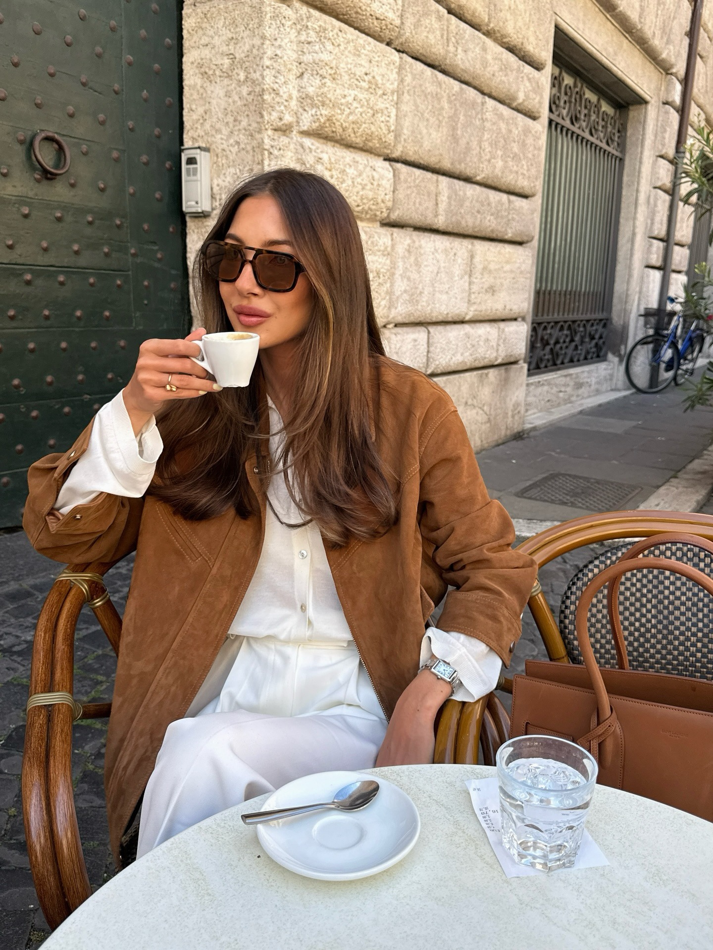 @fakerstrom wearing a tobacco brown suede jacket with white trousers.