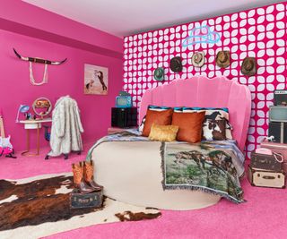 Pink bedhead, cowskin rug, pink guitar