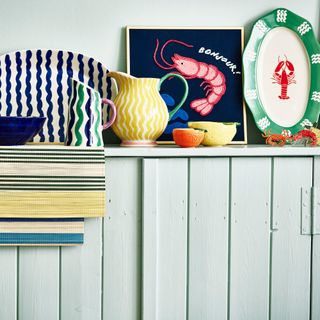 Lobster plates on a blue cabinet