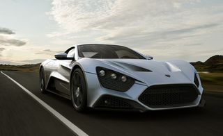 Zenvo ST1 supercar, Denmark. A front view of a silver sports car driving down a country road.