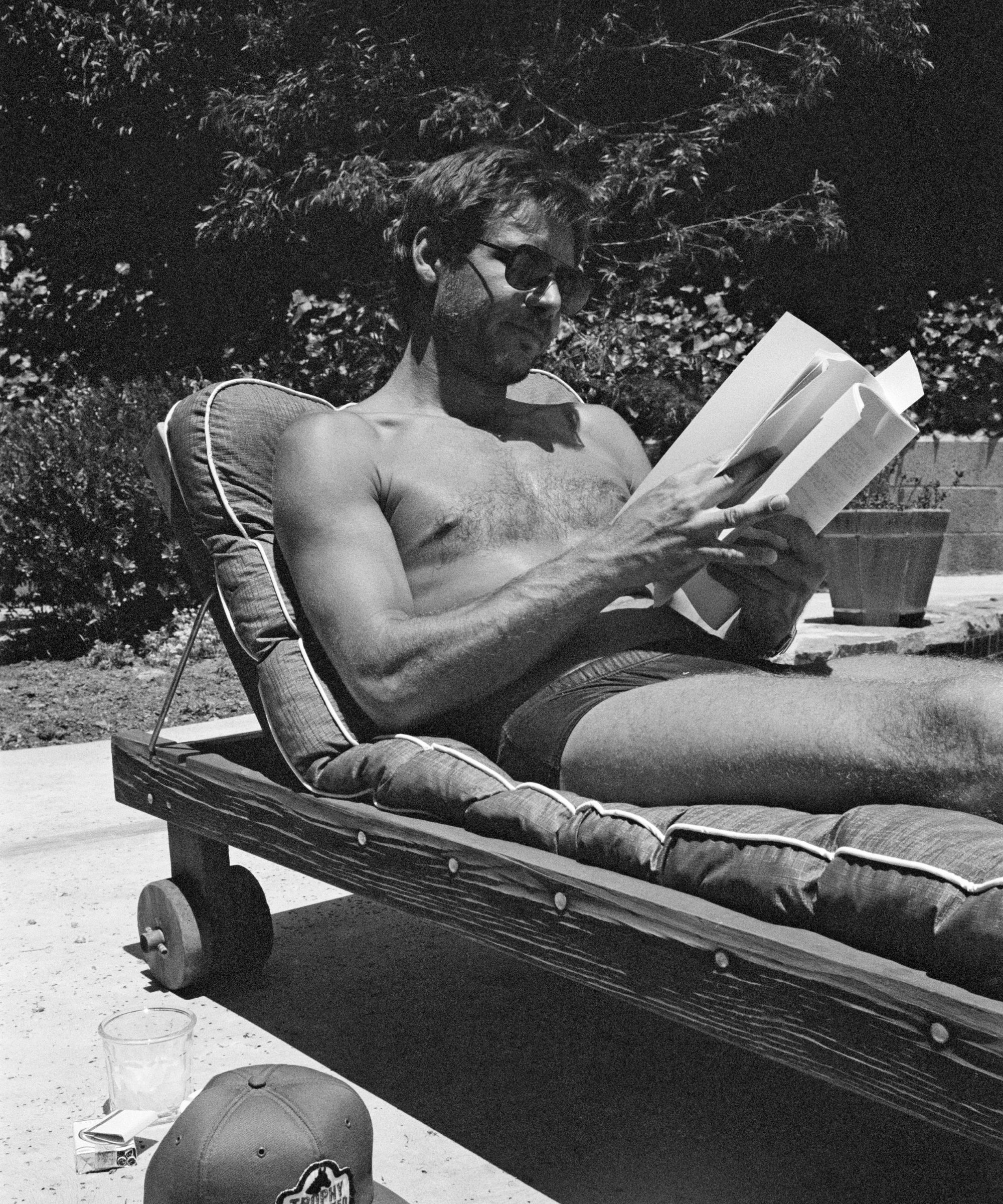 harrison ford beside his pool in the 80s