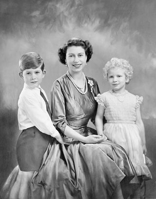 The Queen posing with a young Prince Charles and Princess Anne