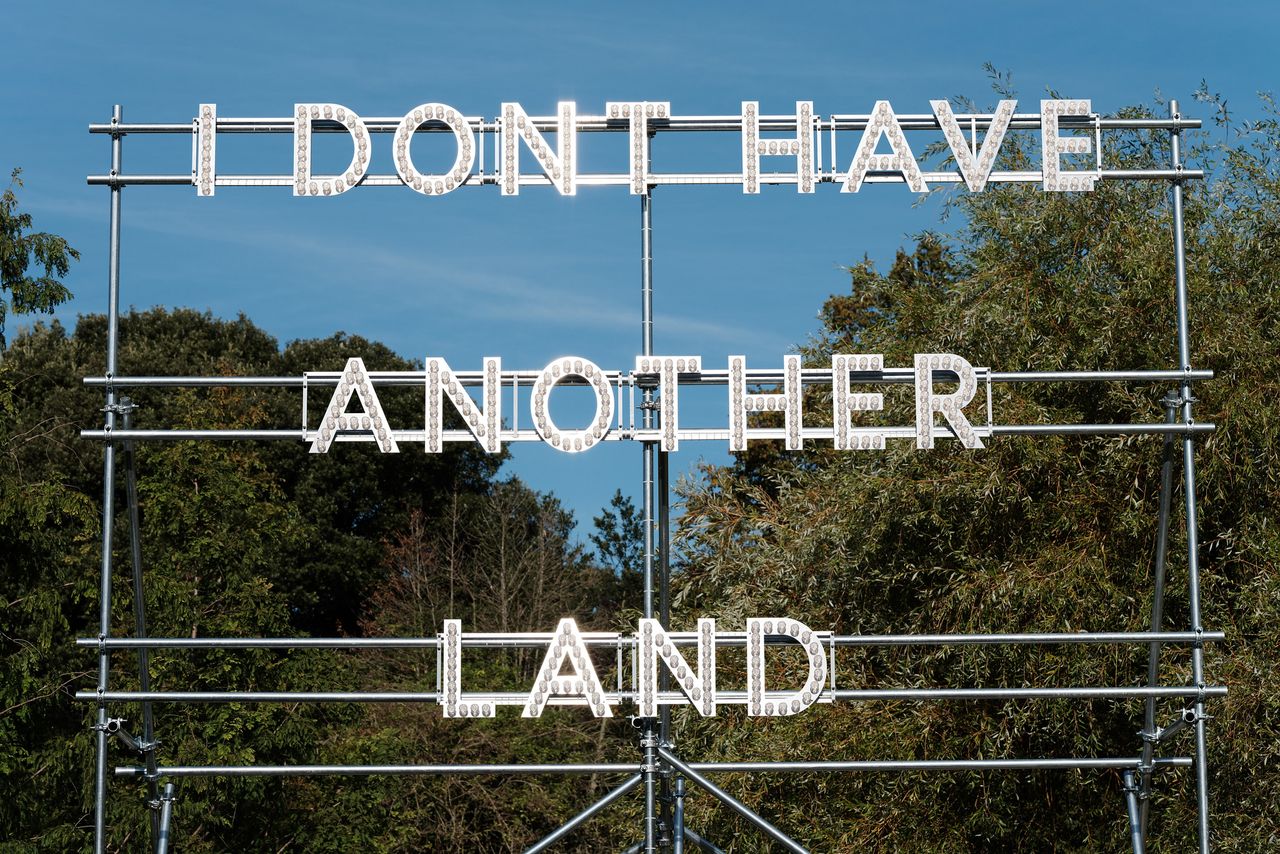 in lights on a frame outdoors, ‘I don't have another land'