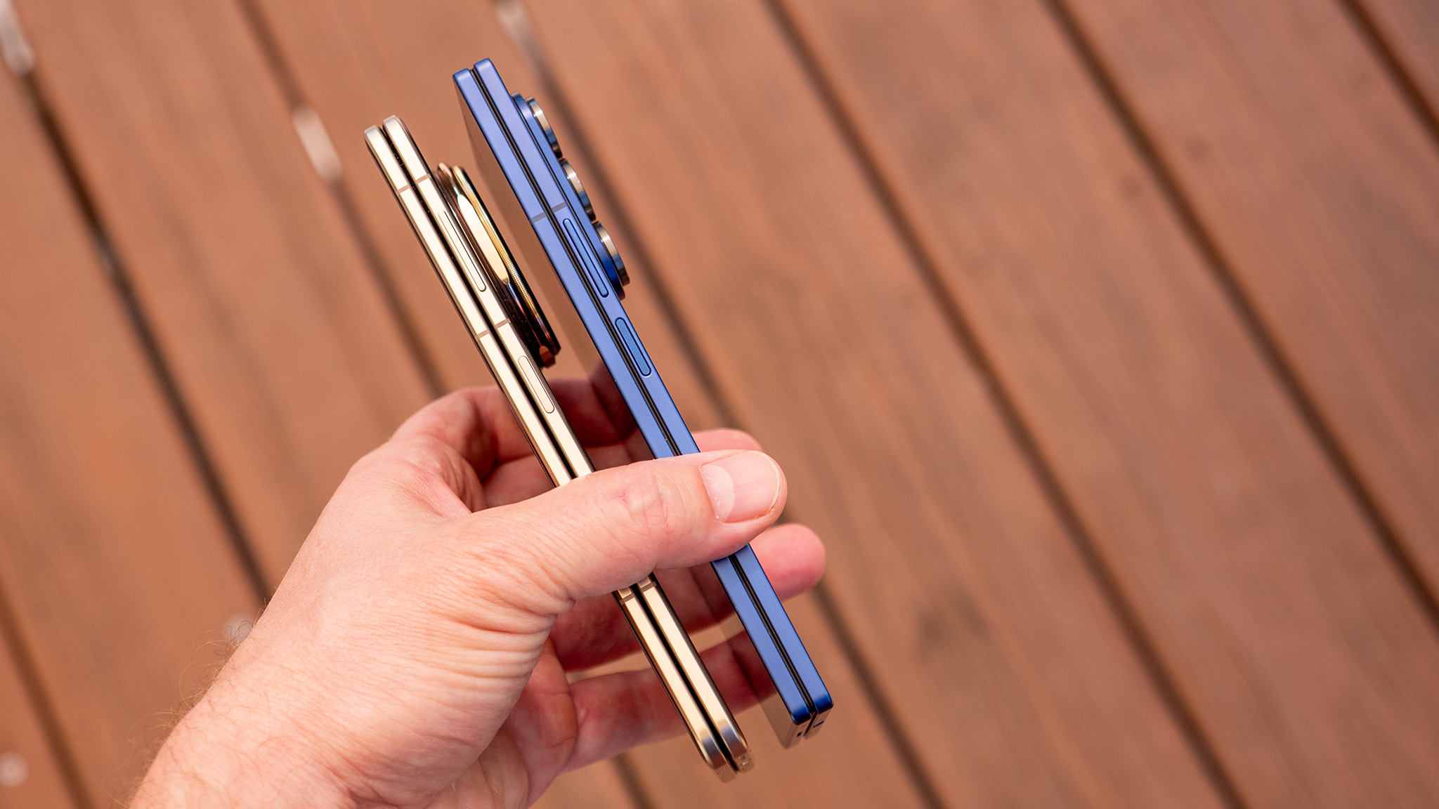 Comparing the gold Honor Magic V5&#039;s hardware with the blue Samsung Galaxy Z Fold 7