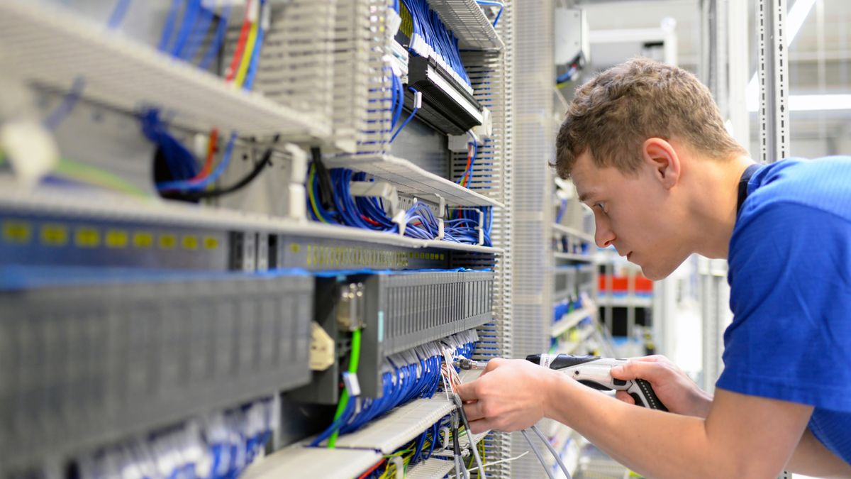 An apprenticeship at work handling electronic components