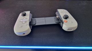 Backbone One PlayStation Edition on a desk mat with RGB border lighting
