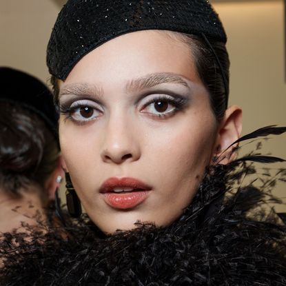 A model wearing lengthening mascara on her long lashes.