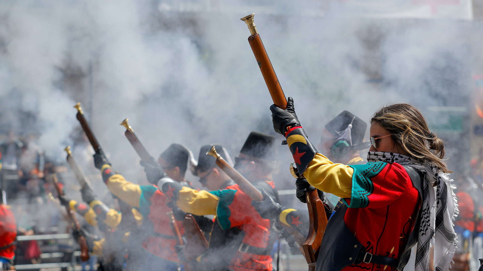 Revellers in costume take part in Alardo'day celebrations, recreating skirmishes between the Moors and Christians using muzzle-loading arquebuses, in Alcoi, Spain