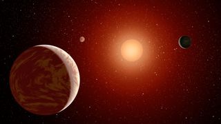 This artist's concept illustrates a young, red dwarf star surrounded by three planets.