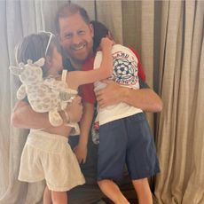 Prince Harry hugging Prince Archie and Princess Lilibet