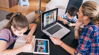 A family looking at multiple screens