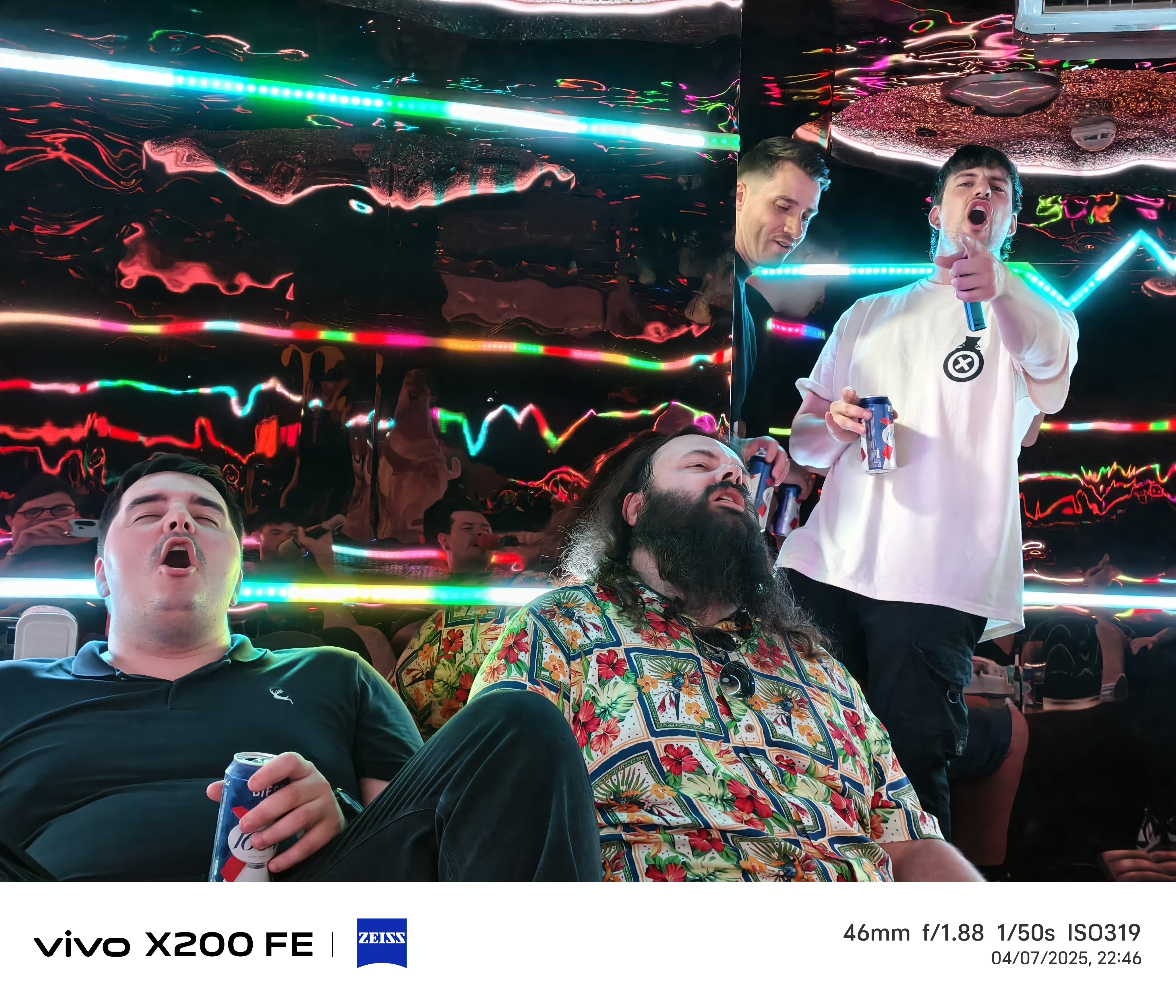 Friends singing at karaoke bar