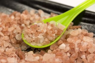 pink salt in a bowl with spoon