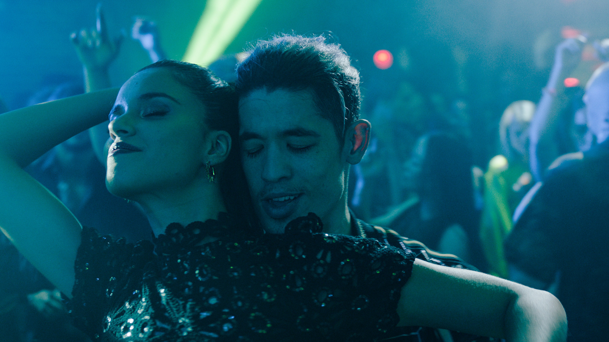 Christopher Chung dancing with a woman in a club in Slow Horses