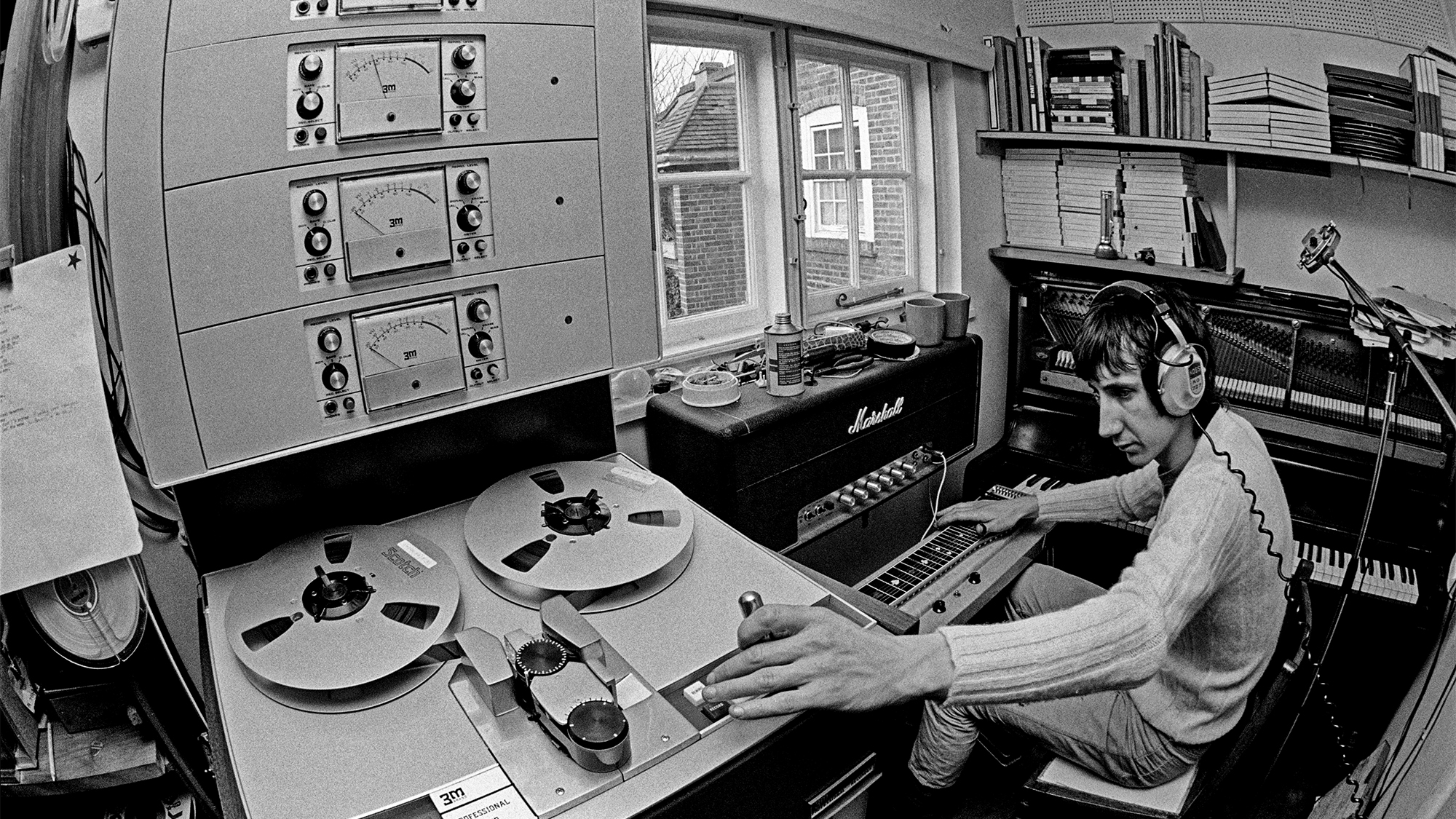 Guitarist Pete Townshend of The Who, in the recording studio at his home in Twickenham, London, 1969. On the right is a Bechstein upright piano.