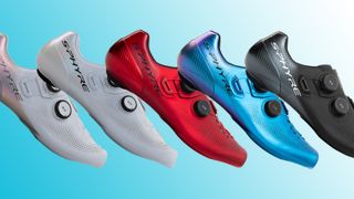 Five Shimano S-Phyre RC903 shoes on a blue background