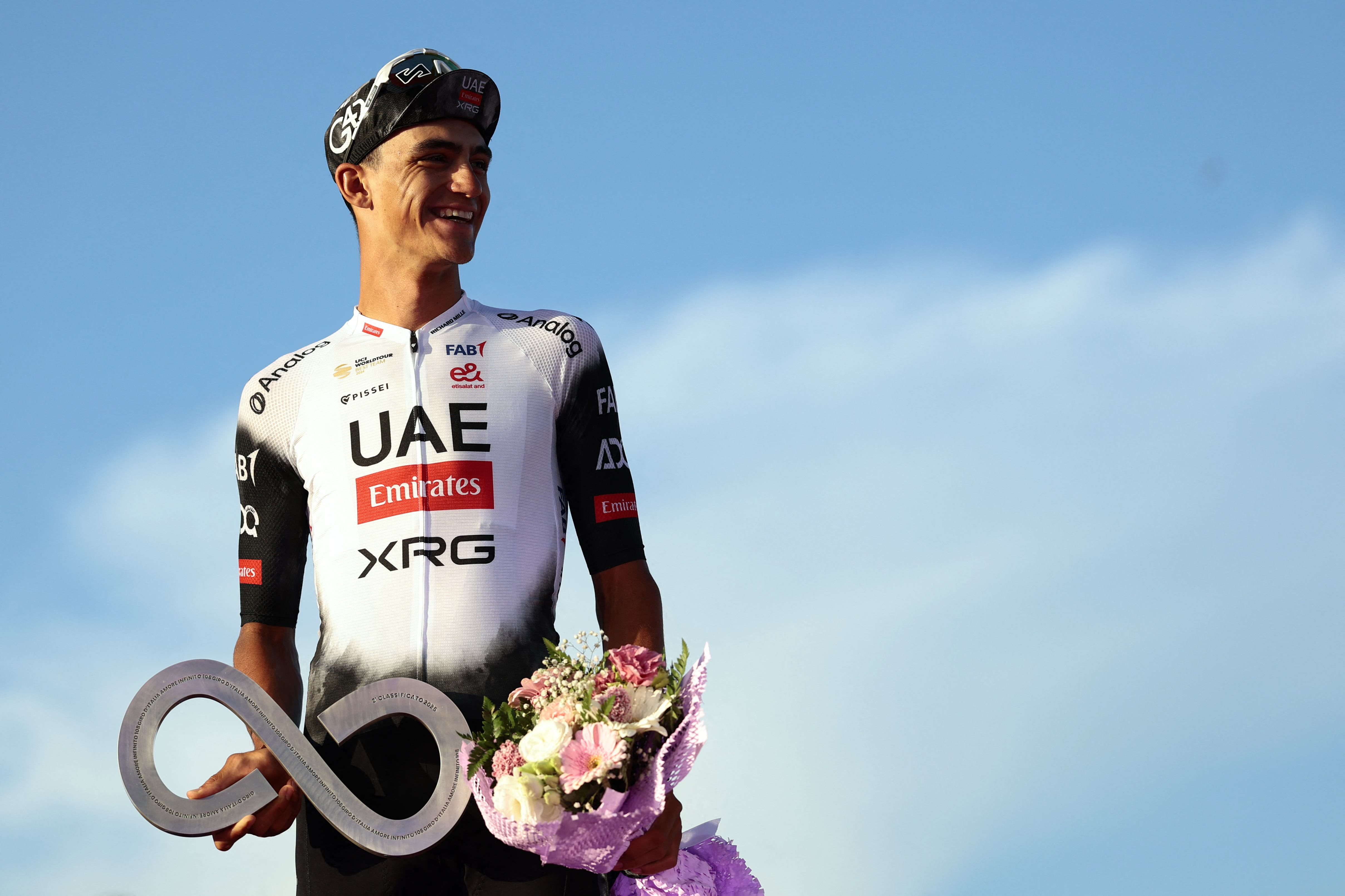 Second placed UAE Team Emirates XRG&#039;s Mexican rider Isaac Del Toro celebrates on the podium at the end of the 21st and last stage of the 108th Giro d&#039;Italia cycling race of 143kms from Rome to Rome on June 1, 2025. (Photo by Luca Bettini / AFP)