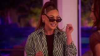 Dorothy Wang smiling with sunglasses on her face in Bling Empire season 2