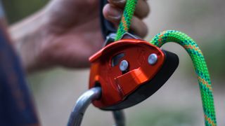 A close up of a belay device